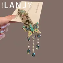 水晶バタフライデザインのヘアクリップ【流れるフリンジ・サイド用・前髪整理】