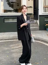 洗練されたデザインの黒ビジネススーツ【広がったパンツ・エレガントなスタイル】（セットアップ対応）