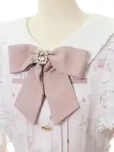 リボンデザインのブローチ【水晶飾り・ピンク・ファッションアクセサリー】