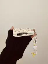スマホケース【折りたたみ式・かわいいカートゥーンデザイン・リボン付き・手提げタイプ】