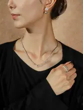 純銀製のダブルレイヤーリング【パールとダイヤモンド装飾・シンプルで洗練されたデザイン】