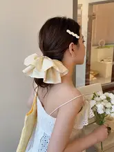 淡い黄色の格子柄ラップスカートヘアゴム【フリル装飾・高級感・おしゃれなポニーテール用】