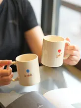 バルーン猫デザインの陶器製マグカップ【ハンドル付き・かわいらしいコーヒーカップ】