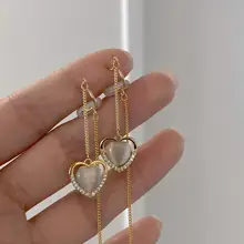 心型キャットアイストーンとフリンジデザインのイヤクリップ【ノー耳穴・品のある印象・小顔効果】