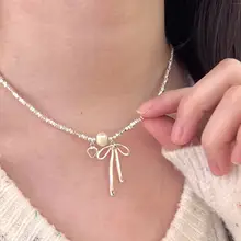 美しいリボンデザインのパールネックレス【鎖骨チェーン・春夏用・高級感あり】