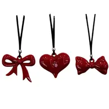 愛らしいリボンデザインのハートネックレス【長めの黒紐・お洒落なニットアクセサリー】