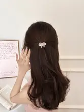 華やかなパールリボン付きサイドヘアクリップ【ピンク・夏用・女性用】
