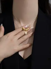 洗練されたデザイン！金色の枝葉モチーフネックレス【ステンレス製・華やかさを引き立てる】