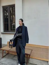 迎春100羊毛製のアシンメトリックニットベスト【バックタイデザイン】