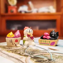 焼き芋を持つ可愛い猫の置物【鈴付き・車載装飾用】