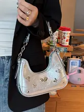 シルバーのアシンメトリーデザインのショルダーバッグ【斜め掛け・女性用・ユニークスタイル】
