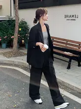 洗練されたデザインの黒ビジネススーツ【広がったパンツ・エレガントなスタイル】（セットアップ対応）
