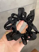 ハンドメイドの蝶結びヘアゴム【デザイナー作品・編み込み】【大人可愛い】