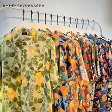 リゾート風フルーツオレンジプリントの短袖シャツ【ユニセックス・ルーズフィット・夏用】